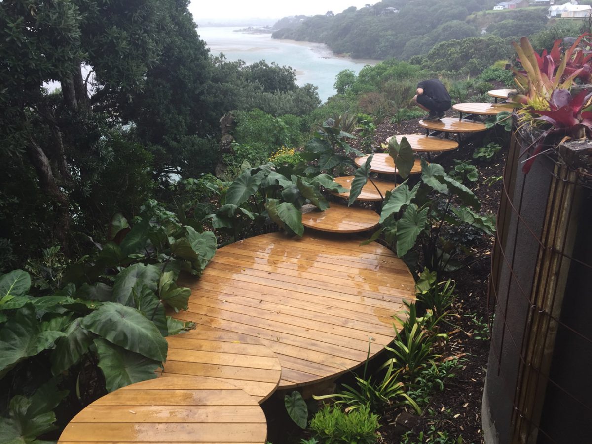 Landscaping construction of steps down a steep property at Mangawhai Custom designed outdoor steps down a hillside garden