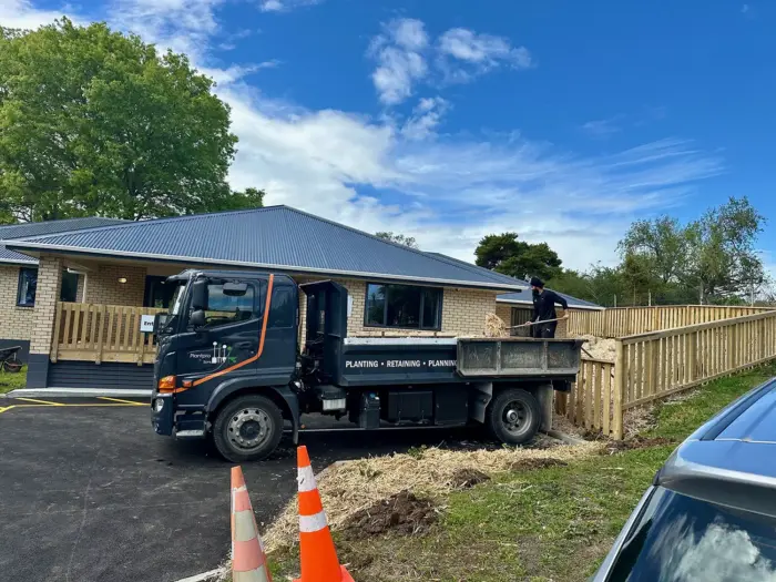 Plantpro and Sons landscaping truck delivering mulch to a garden project in Whangarei, Northland