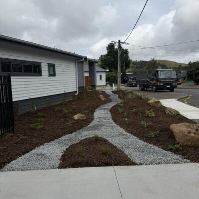 School garden installation with gravel pathway and native planting at Hikurangi School, Northland
