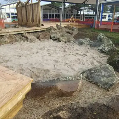Boulder-edged sandpit and timber boardwalk construction at Totara Grove School, Whangarei
