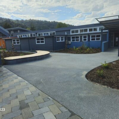 School courtyard paving, concrete paths, curved bench seating and garden beds at Whangarei Intermediate